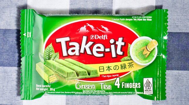 Jakarta, Indonesia - June 8th, 2026 - Delfi take it green tea chocolate bars four fingers pack isolated on horizontal background.