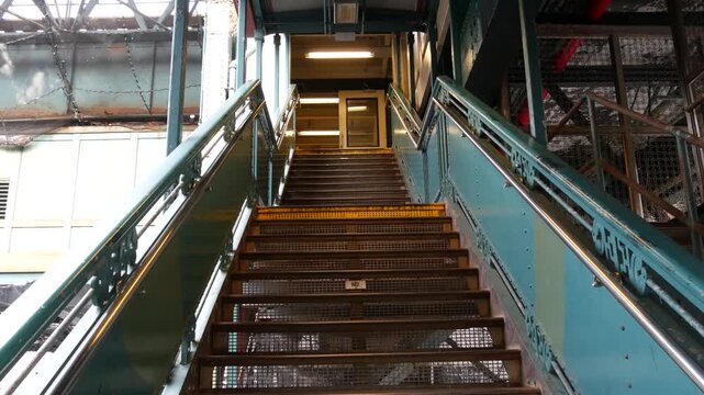 New York City 125 street elevated subway metro entrance in Harlem, United States. American passenger transport, Upper Manhattan. Metropolitan station in NYC USA. Historic architecture, metallic bridge