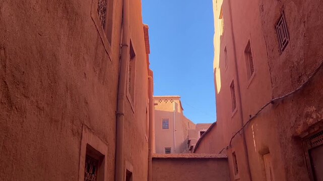 Narrow Alley in the Moroccan Medina with Adobe Buildings
