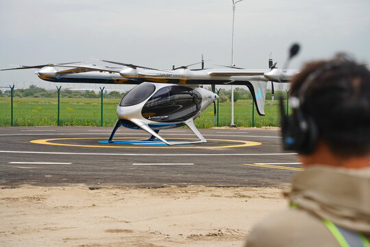 Almaty, Kazakhstan - 05.19.2026 : The air taxi stands on a special platform before take-off. Cloudy weather.