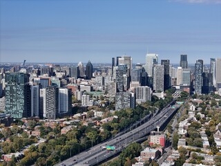 Fototapeta premium Aerial view of Montreal downtown skyline with Autoroute 720 and modern skyscrapers, Quebec, Canada. g.