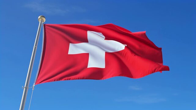 Switzerland flag waving on flagpole against blue sky
