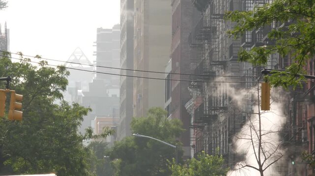 New York City urban residential buildings architecture, Manhattan classic street, United States of America. Typical red brick house, real estate property, USA. Fire escape metallic ladder. Hot steam.