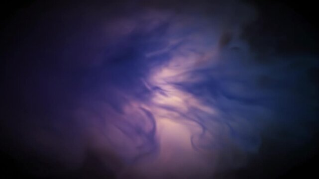 Abstract swirling smoke patterns transition from dark to light, showcasing a dynamic flow of colors and shapes in a visually captivating display of motion