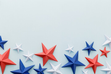 Obraz premium Red, white and blue origami paper stars on a light blue background with large copy space, ideal for patriotic advertising, holiday promotions, greeting cards, invitations, banners, posters, social
