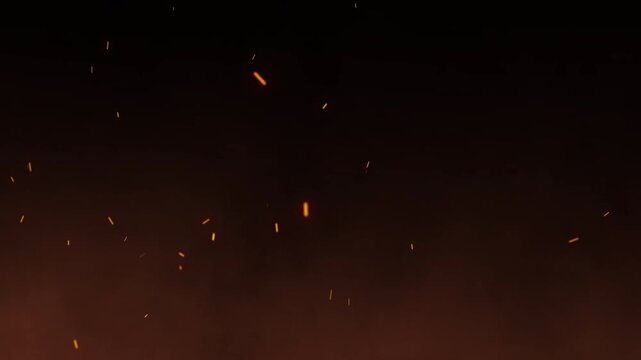 Orange smoke cloud fire spark glowing embers rising on black background. cinematic overlay for video editing with heat and atmospheric particles.