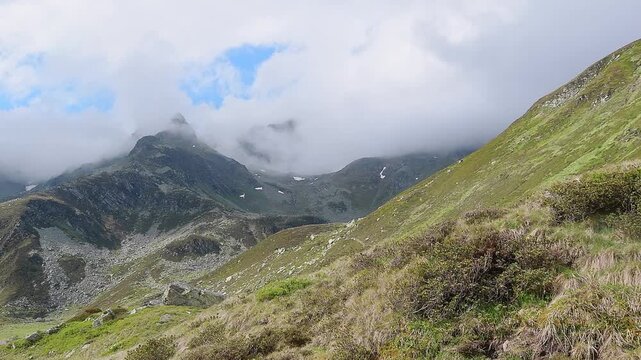 Schwarzhorn wrapped by fogs, Pizzo Suretta landscape in the Montespluga range