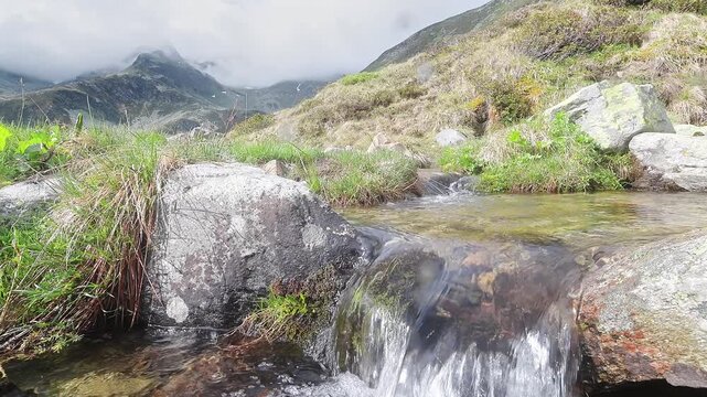 Waterfall with Suretta massif on background, Montespluga landscape