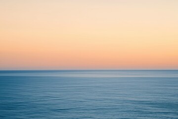 Fototapeta premium The Ocean at Sunrise with Soft Pastel Sky and Calm Serene Horizon