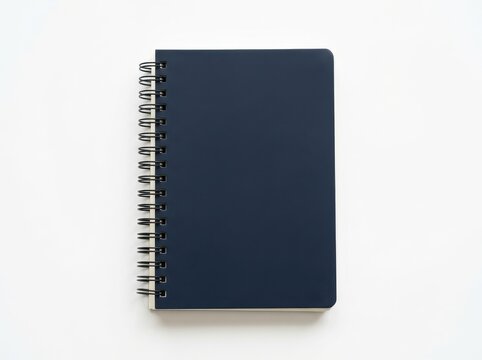 Dark blue spiral notebook isolated on white background