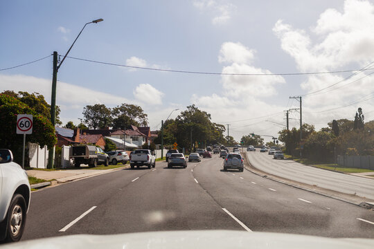 Traffic on city road in Newcastle from passenger POV through car window