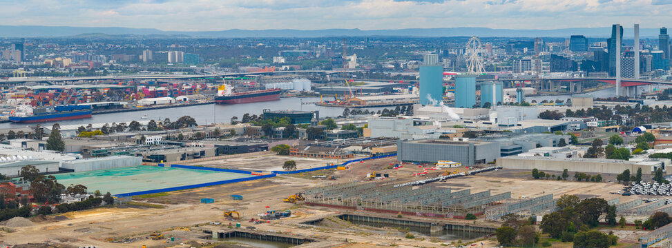Aerial panorama view of vacant land and construction sites near a city port area