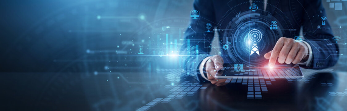 Telecommunications network. Engineer using tablet and hand touch to manage mobile connectivity and global signal transmission. Modern wireless technology and advanced signal processing systems.