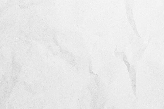 White recycled craft paper texture as background. Grey paper texture, Old vintage page or grunge vignette of old newspaper. Pattern rough art creased grunge letter. Hardboard with copy space for text.