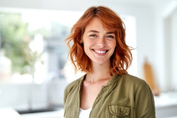Fototapeta premium The woman smiling warmly in a bright modern kitchen with natural light
