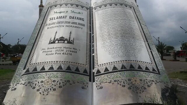 An open Quran displays beautiful Arabic text, reflecting faith, knowledge, and Islamic teachings.