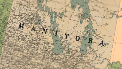 Fototapeta premium Macro View of Vintage Map Highlighting Manitoba Canada with Detailed Geographic Cartography.
