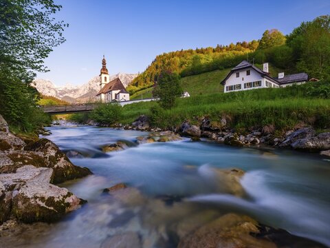 Parish church of St Sebastian on the Ramsauer Ache in the morning, Reiteralpe at the back, Ramsau, Berchtesgadener Land, Upper Bavaria, Bavaria, Germany
