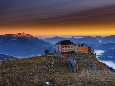 Watzmannhaus at sunrise, fog in the valley, Untersberg on the left in first sunlight, Berchtesgaden National Park, Sch&ouml;nau am K&ouml;nigssee, Berchtesgadener Land, Upper Bavaria, Germany