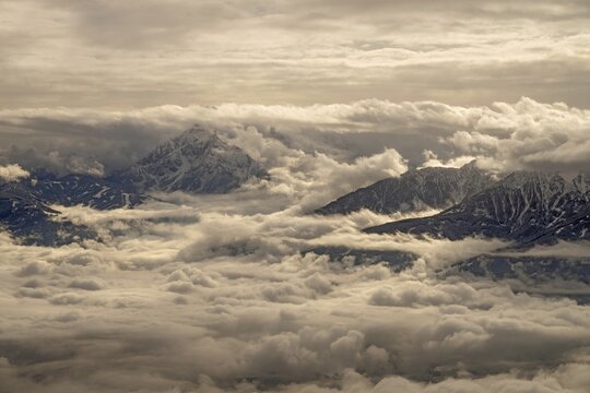 View from the North Range of the Karwendel Mountains looking south, Innsbruck is under cloud cover, Serles mountain on the left center of the picture, Innsbruck, Tyrol, Austria