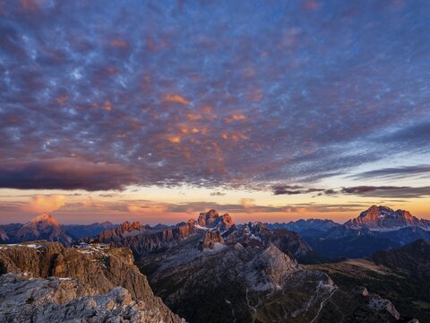 Alpengl&uuml;hen, Rifugio Lagazuoi and rugged Dolomite peaks at sunset, Monte Pelmo in the middle, Civetta on the right, Dolomites, Alps, Belluno province, Veneto, Italy
