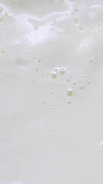 milk surface texture with bubbles close up macro background