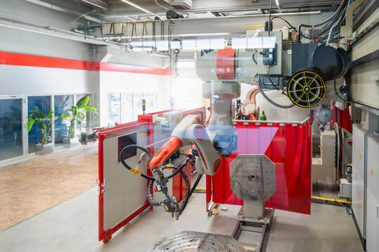 Modern industrial robot in an automated production hall