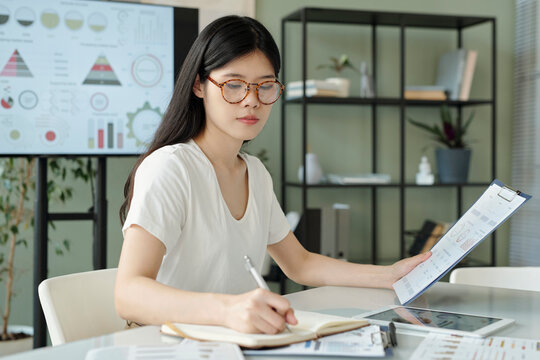 Manager working with documents and charts in an office