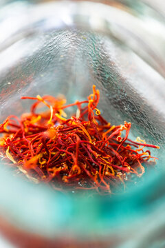 Close-up of red saffron spice in a glass jar in Switzerland