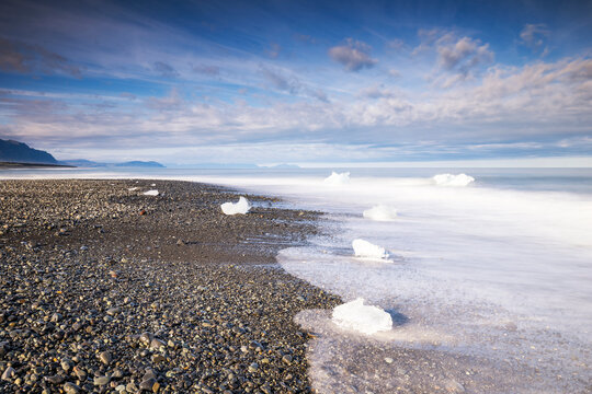 Ice chunks on volcanic shore of Diamond Beach Iceland