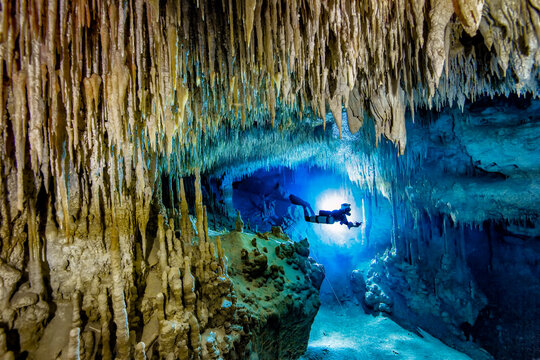 Man scuba diving in sea, Cenote Uku Cusam, Quintana Roo, Mexico