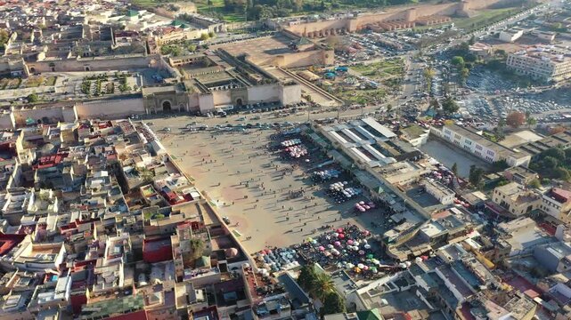 Drone aerial view of El Hedim Square in Meknes, one of Morocco&rsquo;s historic imperial cities. The scene highlights the city's cultural heritage, historic urban fabric, and iconic public space located nea