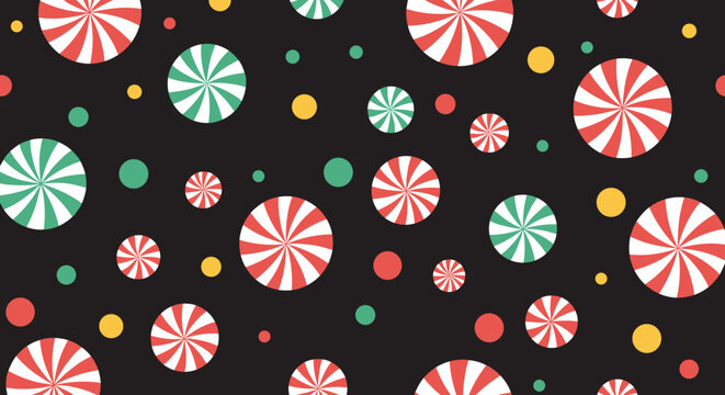 Festive pattern of red and green peppermint candies and colorful dots scattered over a dark black background for holidays.