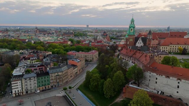 An aerial flyover of Wawel Castle in Krakow at dawn in spring in Poland.