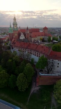 An aerial flyover of Wawel Castle in Krakow at dawn in spring in Poland.