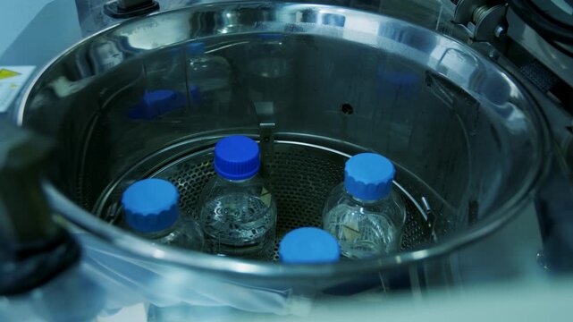Placing Glass Bottle into Autoclave Basket