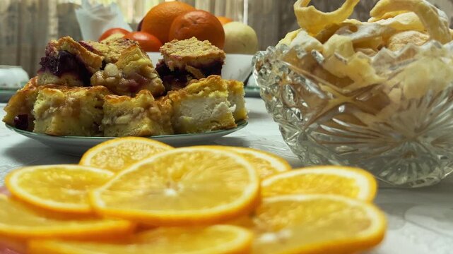 Close-up of Festive Eid Table with Lemon, Sweets, Tea and Homemade Pies