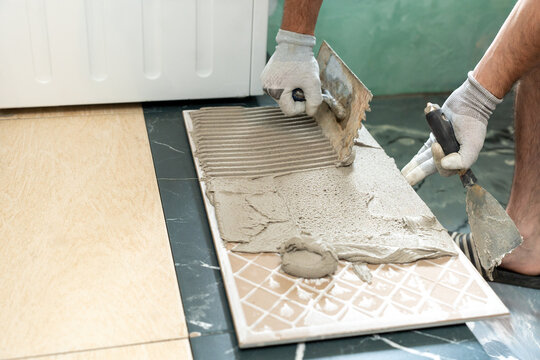 Applying Tile Adhesive During Floor Installation