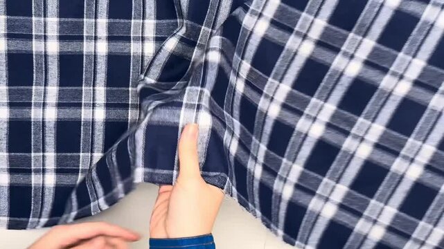 This soft checkered cotton blend fabric is perfect for crafting shirts skirts and dresses offering a comfortable feel durable quality and breathable structure for various clothing projects