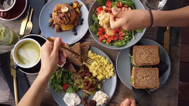 restaurant Table, healthy food or family hands in home with breakfast, coffee drink. Group people, top view man woman eating dinner plate dish, lunch meal or brunch. pastries. lifestyle. toast bread