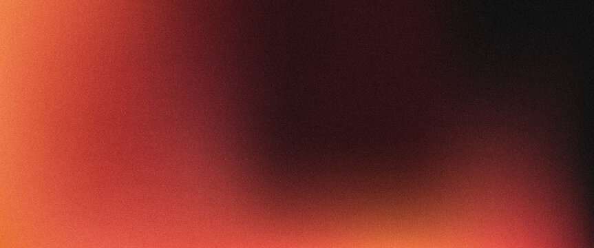 Abstract grainy texture background with warm red and brown tones in soft focus
