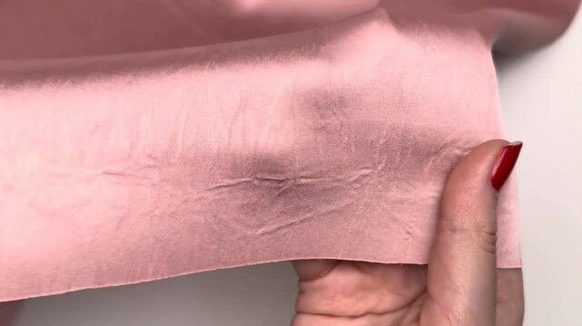 Armani paris wood grain fabric is a smooth soft satin material with a subtle embossed design and a light elasticity that makes it ideal for sewing elegant dresses and stylish clothing items