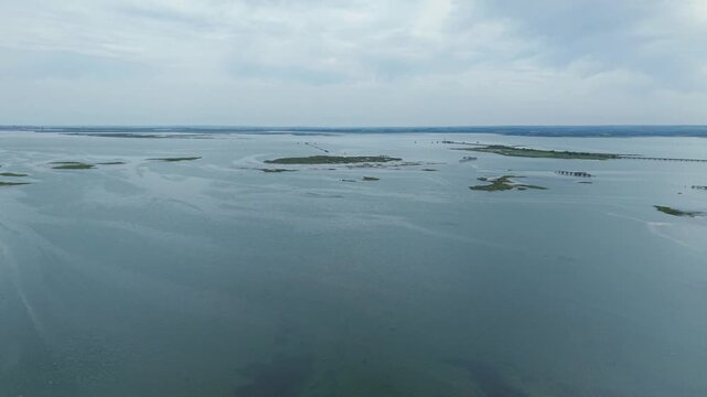 Aerial view of the rusted wreck of a surrendered WW1 German U-boat embedded in the mud flats of the Medway Estuary, Kent, UK.