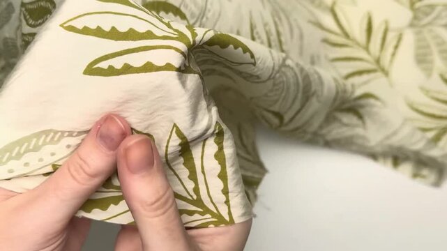 This lightweight breathable viscose silk blend fabric features a subtle textured botanical leaf pattern and is suitable for creating soft elegant summer apparel items