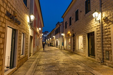 Atmospheric evening street illuminated by lanterns in the old town of Herceg Novi © Sergey Fedoskin