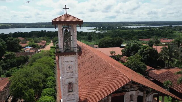 Aerial flies past bell tower of St Ignatius Cathedral in Bolivian city