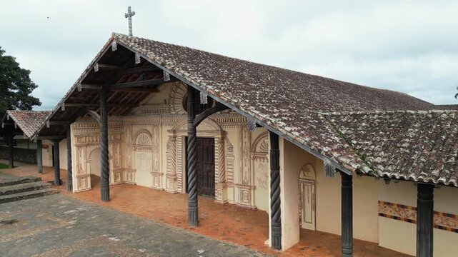 Low aerial dollies along Concepcion Cathedral portico in Bolivian town