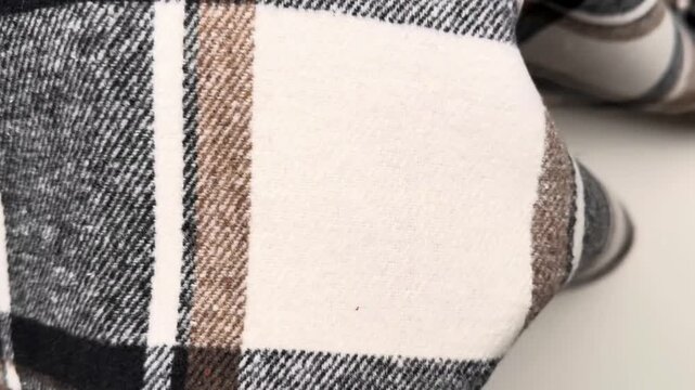 This cozy thermal fabric features a classic plaid pattern on the exterior and a thick insulating cream sherpa lining on the reverse making it perfect for winter outerwear and cold weather accessories