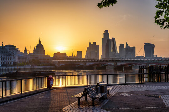 Golden summer sunrise view of the skyline of the City of London, England, seen from Southbank without people