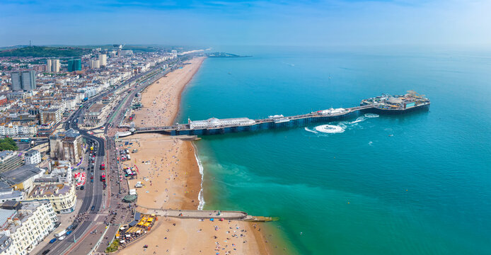 Panoramic aerial view of the cityscape of Brighton, East Sussex, England, with beach and pier during a summer day
